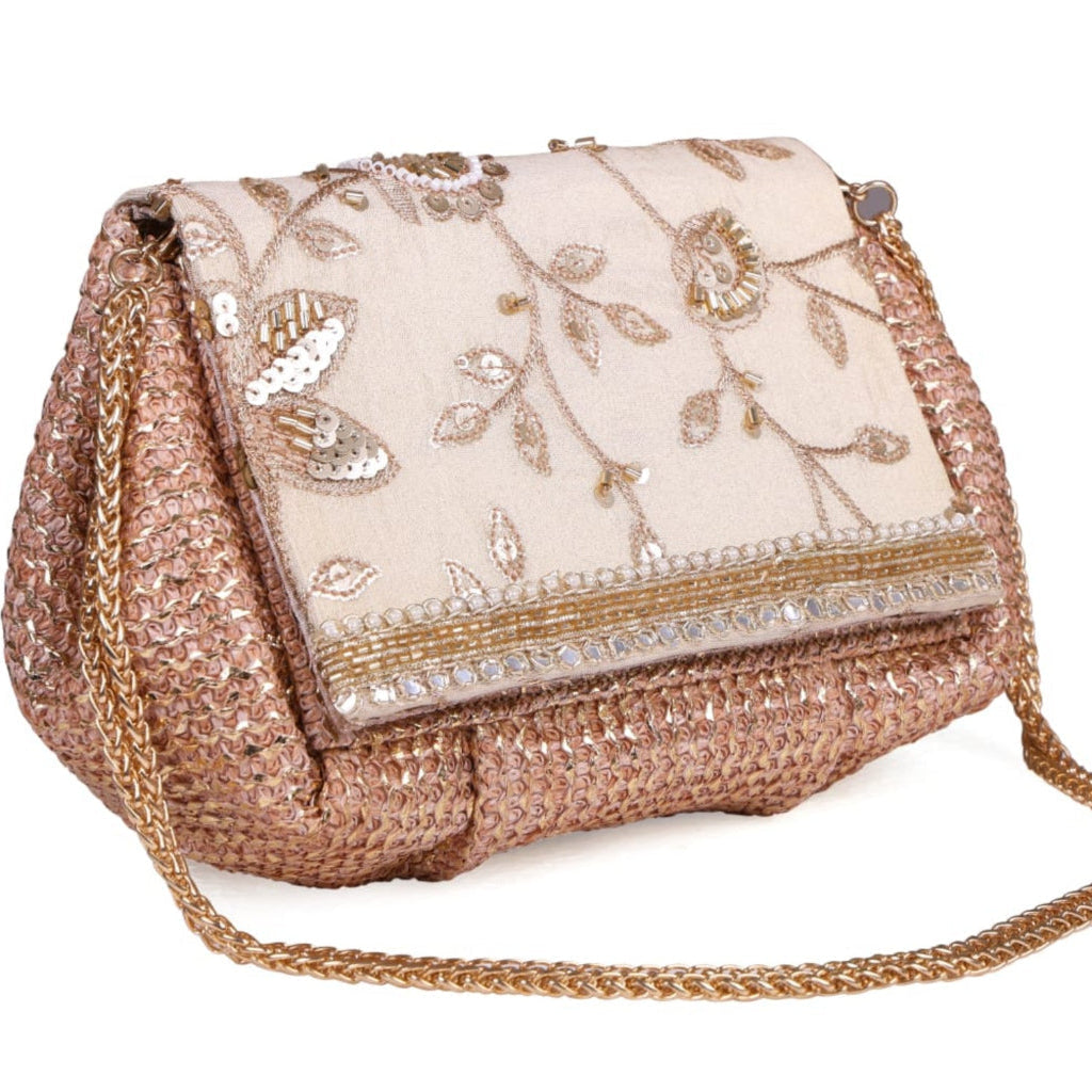 Decorative handbag with floral embroidery and sequin details on a white background