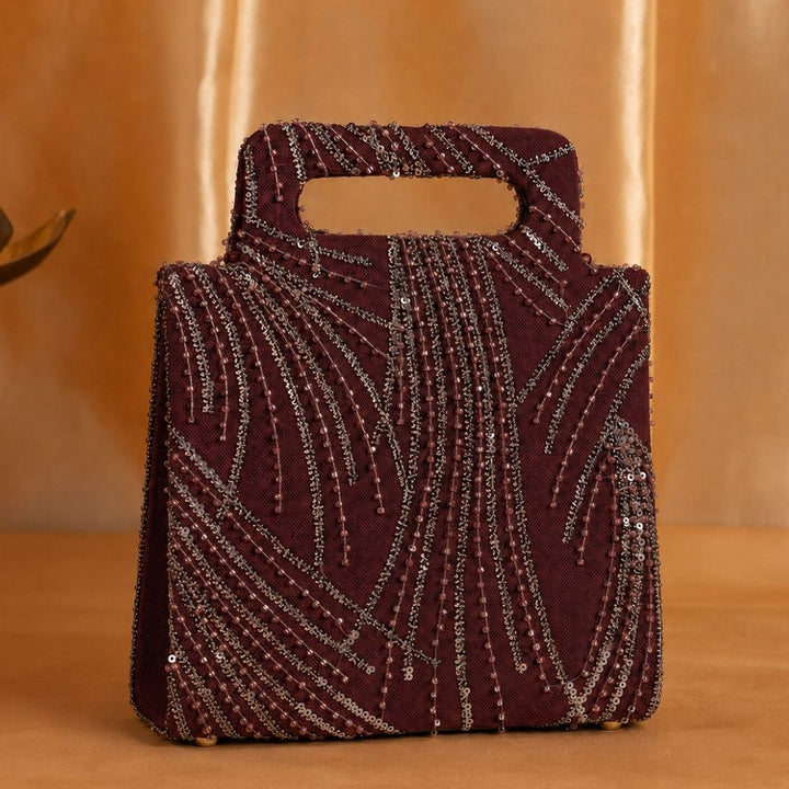 Hand-held Wine colored clutch