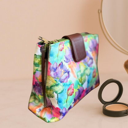 Colorful floral-patterned pouch with a makeup compact on a beige background