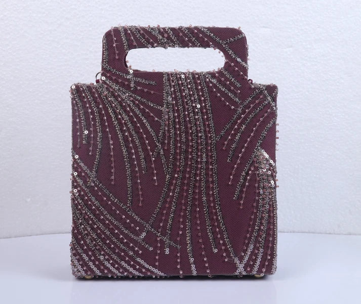 Hand-held Wine colored clutch