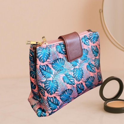 Makeup bag with tropical leaf pattern on a beige background